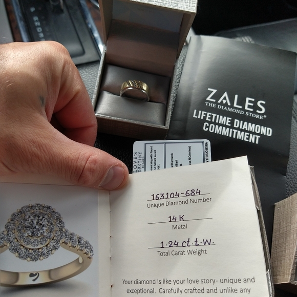 An engagement ring and man's wedding band . - Picture 4 of 10
